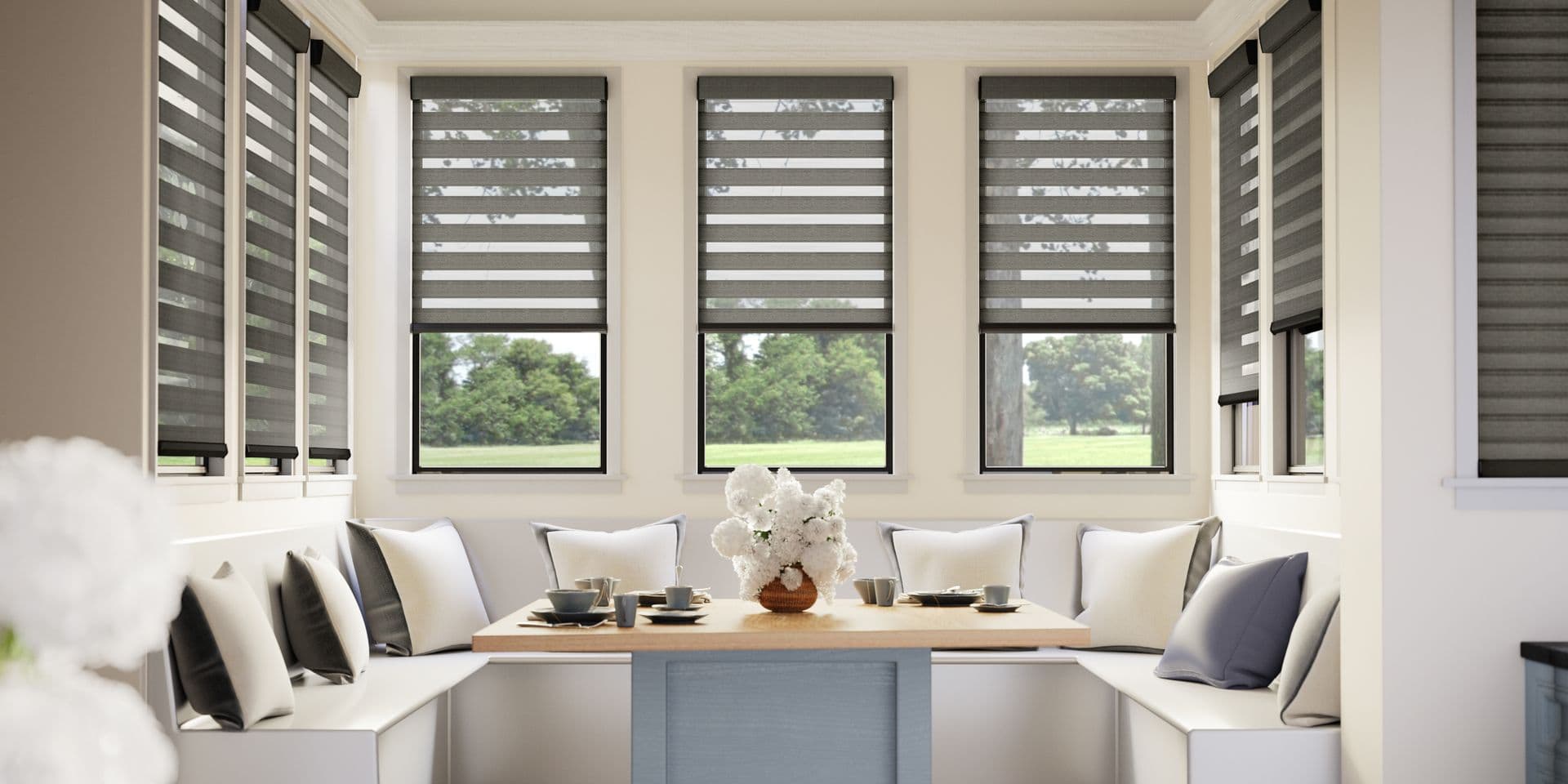 Custom zebra shades installed in a bright breakfast nook